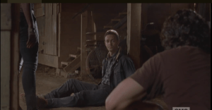 Aaron looks over at Rick, who is crouched down with pen and paper, ready to take notes...on directions to the camp, and on how hot his boss lady gf is when she's taking charge and getting it done!