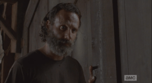 Rick then turns, looks down at Aaron.