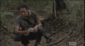 sasha crouches at creek 1
