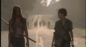 Sasha looks back at the walkers, then at Michonne, tells Michonne,