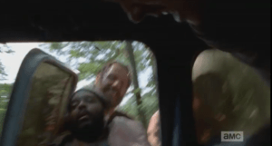 Tyreese is loaded into the car.