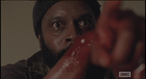 Tyreese points his bloody arm, finger, at the Gov.
