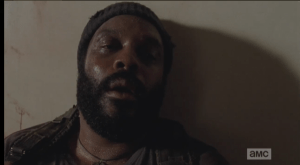 Tyreese, fading out, sees Mika and Lizzie sitting in front of him.