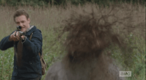 Aaron returns the favor by blowing another walker's head away when it comes up on Daryl. Daryl thanks Aaron, and they turn to save Buttons, but, tragically, they are too late...