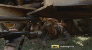 Abraham begins blowing the Under The Truck Walkers away by firing into their heads...