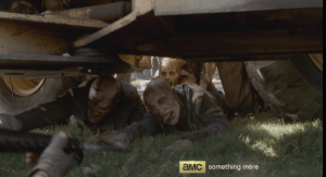 ...and drawing the walkers under the truck, after him.