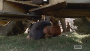 ...while Abraham quickly slides under truck, taking momentary cover there...