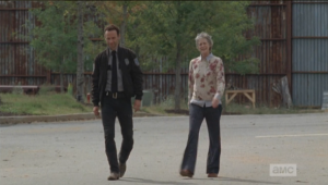 Carol excuses herself, seeing Rick, telling the other JL ladies that she needs to ask him for his help with the party.  As they walk together, Rick and Carol agree that tonight would be the night to break into the armory, as everyone will be at the party.