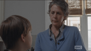 Carol asks Sam who the gun is for. He doesn't answer.