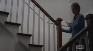 Carol hears a rustling noise downstairs...she pads lightly, quickly down the stairs...