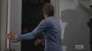 ...and opens the cupboard door, quickly, and finds Sam inside.