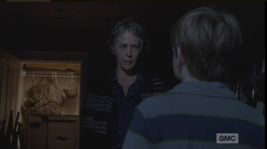 Carol's face loses its smile.