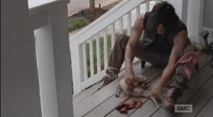 daryl cleans possum in porch