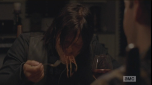 Speaking of pained looks, back at Aaron and Eric's, Daryl is shoveling spaghetti into his mouth, slurping the noodles noisily...