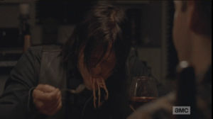 Speaking of pained looks, back at Aaron and Eric's, Daryl is shoveling spaghetti into his mouth, slurping the noodles noisily...