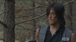 Daryl watches the horse a moment, then reaches for Aaron's rope.