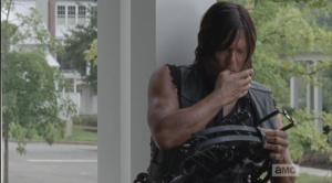 Daryl sits at his usual spot on the front porch, tinkering with his crossbow...something pinches his finger, and he winces, sucks on it a moment before getting back to the task at hand.