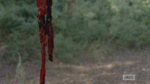 D'oh! Walker's gone, just a bloody chain with flies buzzing around it.