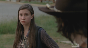 Carl looks over at Enid, who is watching him.  They regard each other for a moment, and then Carl asks her, 
