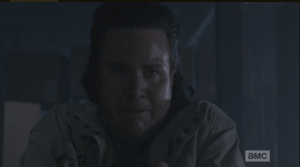 Terrified, Eugene backs away from the advancing walker...