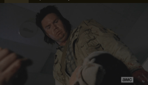 Looking down at Tara's still form, Eugene seems to know what he must do. The sounds of the walkers have died down, and there are none around the office...they are surely being diverted by the others. Eugene stands to his full height...