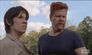 Abraham looks down at Tobin, slumped against the truck, as Francine mutters,