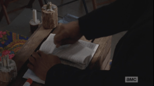 Faster and faster, Gabriel rips out the bible's pages...