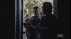 Glenn motions for them to wait a moment more, then Aiden speaks up, suggesting they get a move on...they go in, be careful, get it done. Glenn agrees, pulls out his gun.