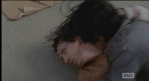 ...Glenn throws Nicholas down and pounds him into the pavement until he's out, cold.