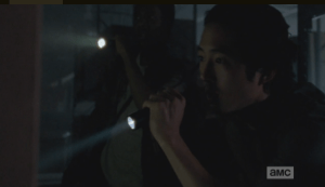 The S.W.A.T. walker's armor has a grenade clipped to its shoulder, and Aiden continues to shoot at the walker.