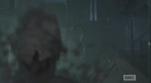 Glenn blasts another oncoming walker's brains all over the lens.
