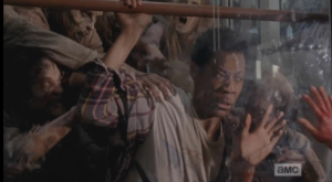 Noah gets thrown up on the glass of the door by the walkers. The expression on his face as he looks at Glenn is agonizing to watch.