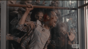 The walkers begin to bite into poor Noah's flesh as he screams in agony.