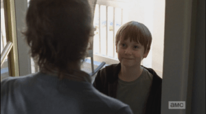 Carol opens the door to a grinning Sam.