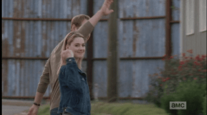 As Rick, Daryl and Carol are let back into the gates, Rick sees Jessie walking with her husband, McBeaty. Jessie flashes Rick her scarlet