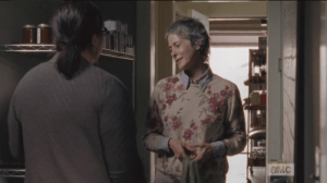 Back in town, JL Carol is following Olivia into the storeroom. Olivia expresses amazement at JL Carol's revelation that applesauce can be used in lieu of eggs in a cookie recipe...surely, Alexandria must have some yard chickens, somewhere, but eggs are probably still in short supply. Carol asks Olivia if she can keep the applesauce thing between them, as it's the