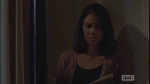 Hidden in the stairwell, Maggie listens to all this, troubled.