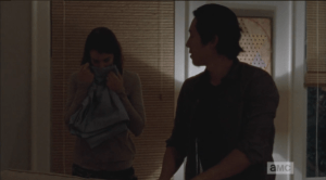 As Carol sketches in a notepad, Maggie takes a deep whiff of the clean linens...she has probably really missed that smell, and the feel of being clean and comfortable.