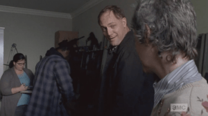 Tobin smiles at Carol, introduces himself, and offers to teach Carol to shoot, any time. Better safe than sorry.