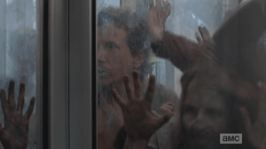 Trapped in a section of revolving door, walkers on all sides, Nicholas is buggin', hard.
