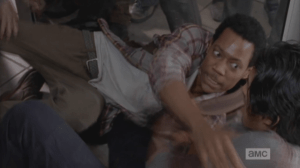 Noah looks at Glenn, who clings to him...