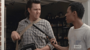 Later, as they prepare to go out on a run for a new micro-inverter for the solar grid, Noah holds out a gun for Eugene to take. Eugene tries to decline the offer.
