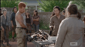 Deanna tells them they can check out their guns at any time when they go outside the walls...