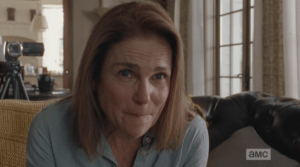 Deanna blinks, once, then asks, with raised eyebrows and pursed lips,