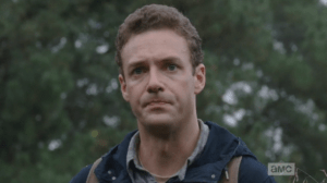 Poor Aaron and Daryl must watch as poor Buttons gets taken down.