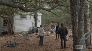 The Porch Council has convened outside the abandoned little house in the woods where Rick had stashed his handgun in the plastic blender... there is a walker nearby, but Daryl says it's only one, rejoins the council.