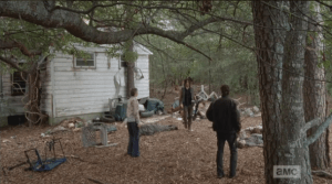 We see Rick, in his constable's uniform, Carol, in her Junior League uniform, and Daryl in his Daryl Dixon uniform, vest and greasy hair. Brother has still not taken a shower yet...that's some willpower. I would have taken like 25 showers by now, and brushed my teeth like 100 times.