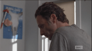 Rick sits on the edge of the bed, diplomatically says that the place
