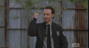...and Rick flashes his scarlet letter back to her. He watches McBeaty put a protective arm around his wife as they walk away...