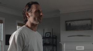 Rick Grimes smiles a secret smile in response to this, bounces back and forth a bit lightly between his feet, like, 'Yeah, right, asshole, so you can either drunkenly molest my kids or mismanage their care in the throes of a violent hangover...I don't fucking think so.'